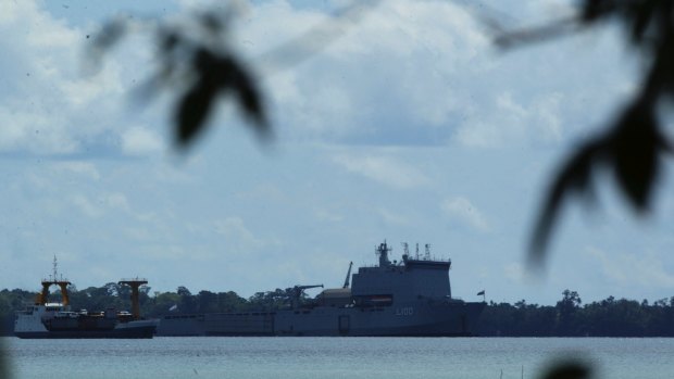 The HMAS Choules, sitting off the Lombrum base in 2013, after a border protection operation.