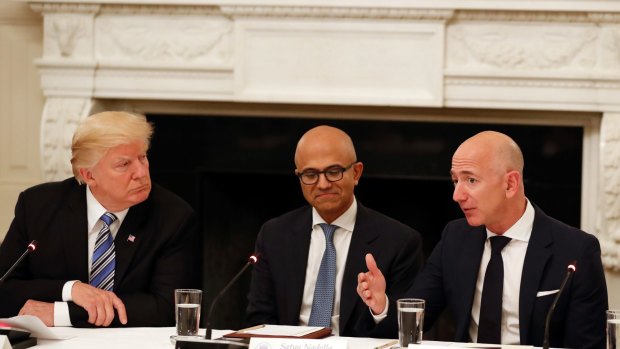 Donald Trump with Microsoft CEO Satya Nadella and Amazon boss Jeff Bezos.