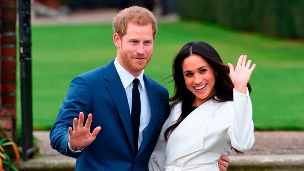 Britain's Prince Harry and Meghan Markle pose for the media at Kensington Palace in London.  They will be married later this month.