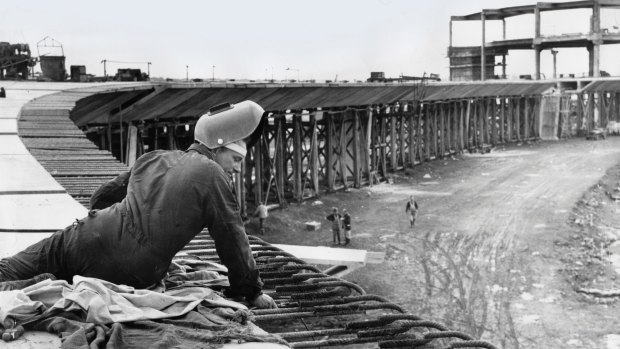 This elevated roadway will serve overseas travelers when the airport opens to international traffic in 1968.