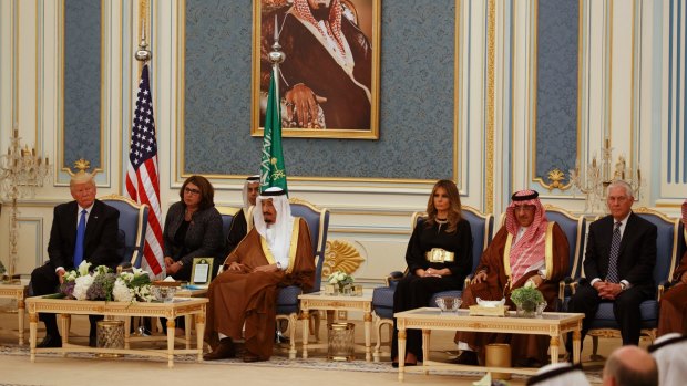 President Donald Trump listens during a coffee ceremony and presentation ceremony of The Collar of Abdulaziz Al Saud Medal at the Royal Court Palace in May, 2017.