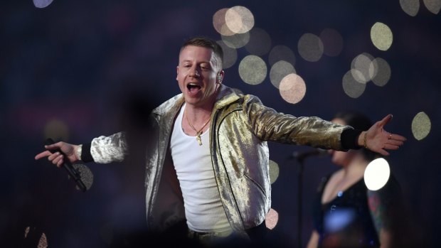 Love game: US artist Macklemore performs during the NRL grand final. 