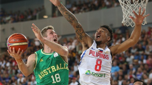 Jesse Wagstaff attempts to score under pressure from Calvin Abueva of Philippines during the FIBA World Cup qualifier match at Margaret Court Arena