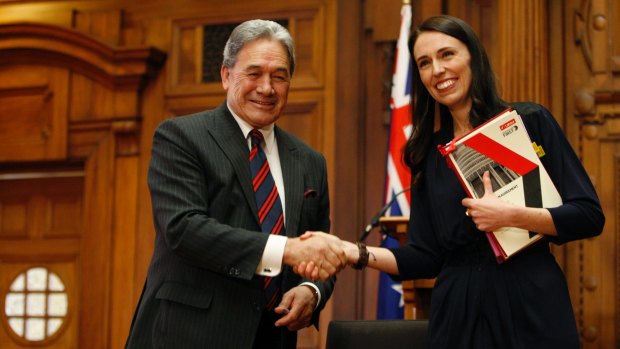 New Zealand Prime Minister Jacinda Ardern, right, with New Zealand First leader Winston Peters after signing their coalition agreement. Ardern came to power with a vow to cut migrant intake.