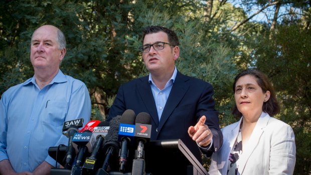 Premier Daniel Andrews, standing beside ministers responsible for energy safety and public housing, has been urged to act.