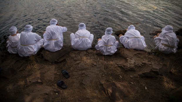 Members of the Mandaean community, who are followers of John the Baptist, gather at the Nepean River, Penrith.