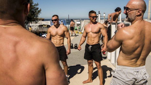 North Bondi's outdoor gym was busy with muscle-bound men flexing and posing on Saturday.