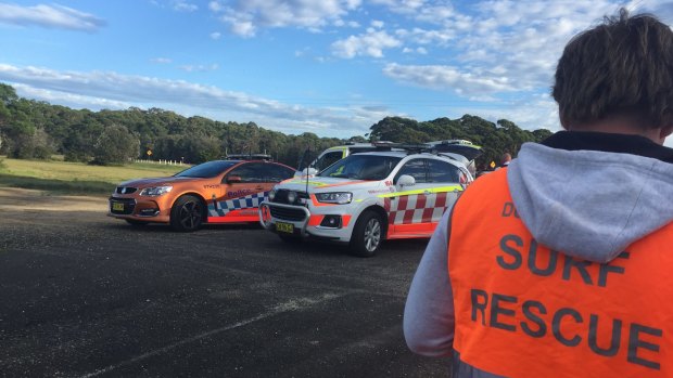 Lifesavers and police in Moruya after a boat capsize on March 24.