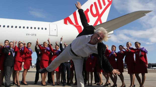 Richard Branson in happier times with Virgin Australia staff: The billionaire has snatched his UK airline Virgin Atlantic from the brink of collapse this week, but at a high personal cost. 