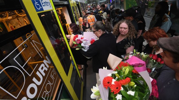 People carrying flowers boarded at each stop.