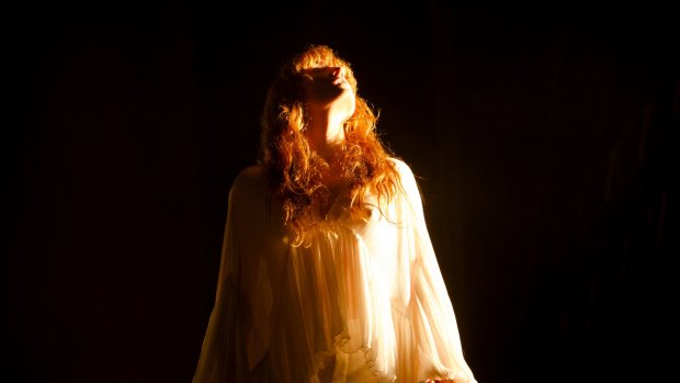 The self-described English ghost, Florence Welch, on stage with Florence + the Machine.