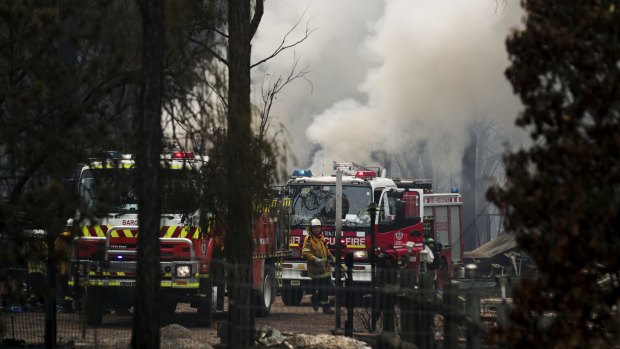 Firefighters responding to a flare up at a property previously impacted by a bushfire earlier in the week between Tahmoor and Bargo.