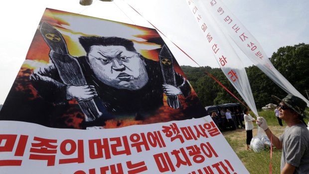 Defectors prepare to release balloons carrying leaflets and a banner denouncing Kim Jong-un in 2016. Such continued campaigns have enraged the Kim regime.