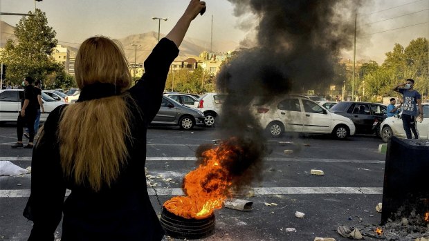 Iranians protest the death of 22-year-old Mahsa Amini after she was detained by the morality police, in Tehran in October.