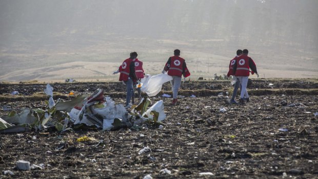 Rescuers work at the scene of an Ethiopian Airlines flight crash.