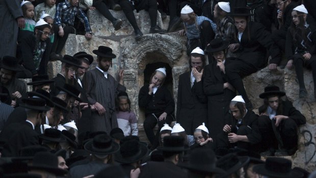 Ultra-Orthodox Jews take part in the "Mayim Shelanu" ceremony to collect water from a natural spring, near Jerusalem. The water is used to make matza, the traditional unleavened bread to be eaten on the Jewish holiday of Passover.