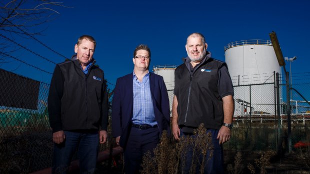 Director of Capital Recycling Solutions Adam Perry, Dean Ward from ActewAGL, and project manager Ewen McKenzie at the former Shell site marked for development as a waste recycling facility. 