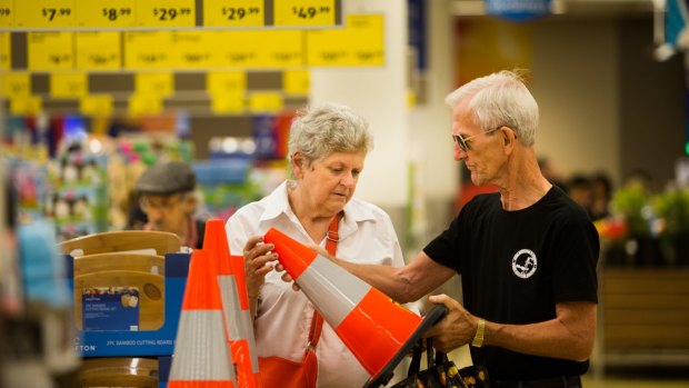 Shoppers Peter and Mary Ford inspecting traffic cones at Aldi. 