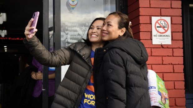 Independent candidate for Fowler Dai Le (right) in Cabramatta on Saturday.