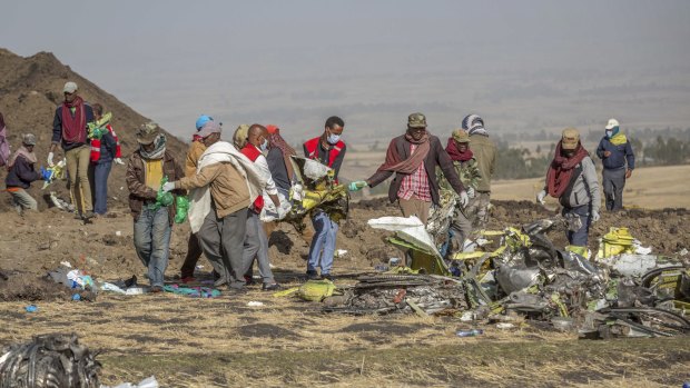Rescuers work at the scene of an Ethiopian Airlines 737 MAX flight crash, south of Addis Ababa, in March.