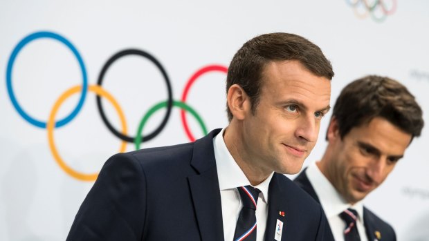 French President Emmanuel Macron (left) and Paris organising committee  boss Tony Estanguet.