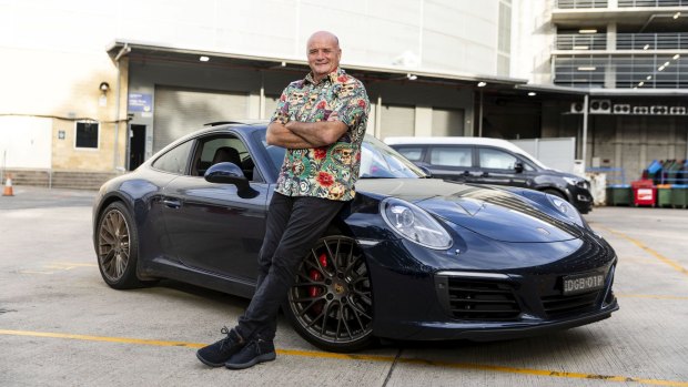 Paul with his Porsche that he allows 
a player to drive as a reward for a good game.