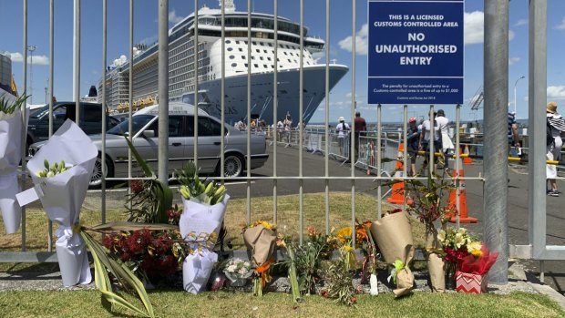 Makeshift memorial is seen in front of cruise ship Ovation of the Seas, in Tauranga, New Zealand on Tuesday. 