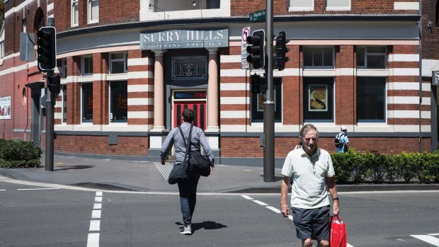 The City of Sydney wants shorter wait times for pedestrians in village centres, such as Surry Hills. 