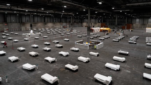 Health workers prepare to receive the first patients with coronavirus at a reconfigured exhibition complex in Madrid, Spain. 