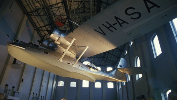 The Catalina Flying Boat is anchored to the roof of the Powerhouse Museum.