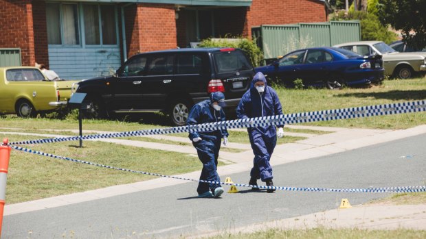 Forensics officers at Goodenia Street, Rivett, after Bobby Allan was found dead.