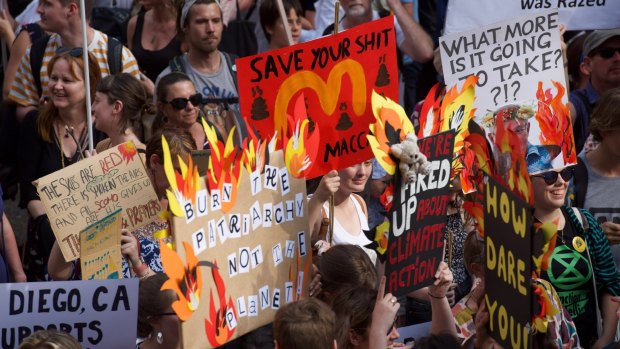 Thousands of protesters rally in front of Sydney Town Hall calling for action on climate change.