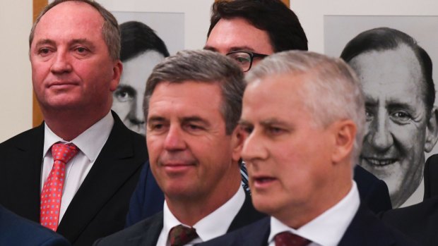 Barnaby Joyce (left) behind Nationals leader Michael McCormack (right) at a party room meeting in February 2018, after Mr Joyce was forced to resign from the leadership.