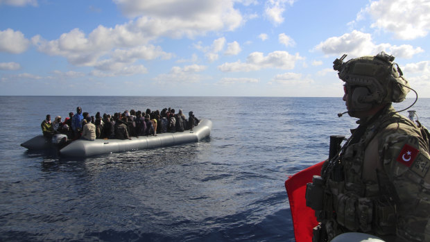 The conflict in Libya has forced thousands of people to flee in search of a better life in Europe. Here, migrants are picked up by the Turkish military on January 29 and returned to the Libyan Coast Guard.