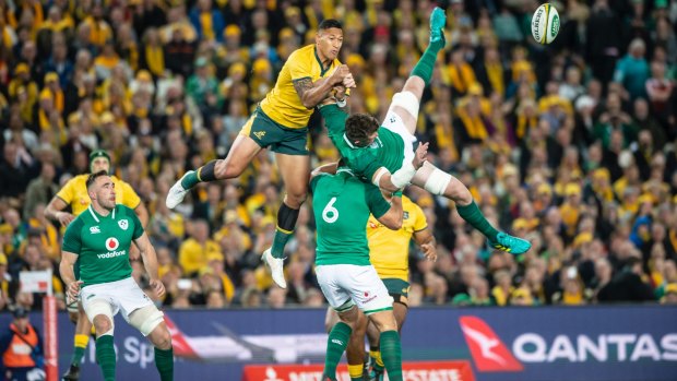 Wallabies fullback Israel Folau contests a kickoff, while Ireland's CJ Stander lifts captain Peter O'Mahony in the air. Photo: Sitthixay Ditthavong
