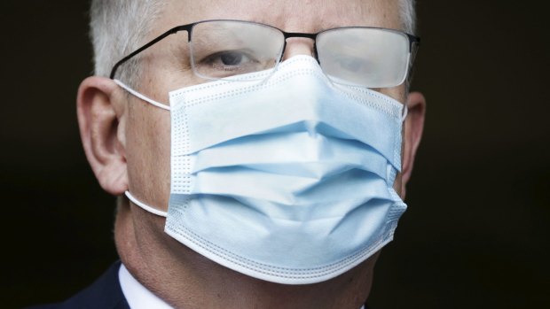 Prime Minister Scott Morrison with fogged glasses from wearing a mask in Canberra in August.
