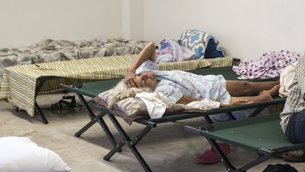 A resident inside a shelter after being evacuated from a home near Guajataca Dam in Isabella, Puerto Rico.