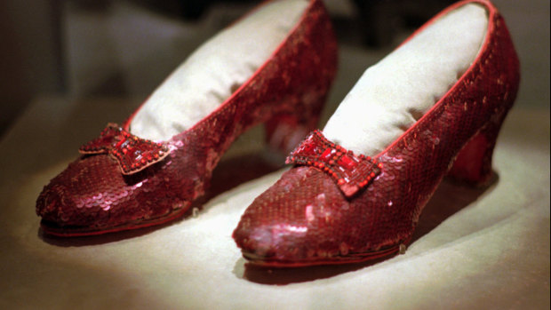 One of the four original pairs of ruby slippers worn by Judy Garland, as Dorothy, in The Wizard of Oz. A pair has been restored at the cost of $30,000.