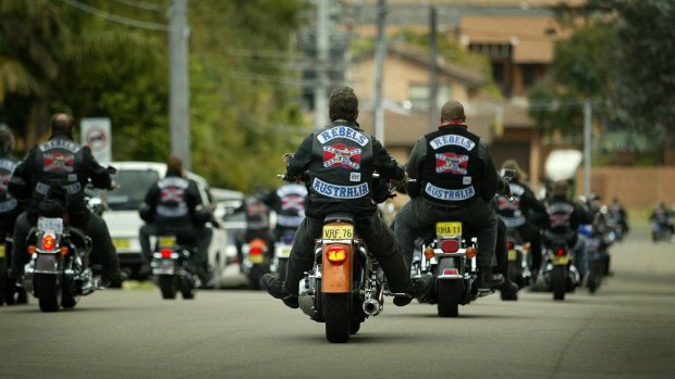 Rebel bikie gang members ride in a group.