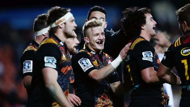 Damian McKenzie, centre, proves you don't have to big to succeed in Super Rugby.