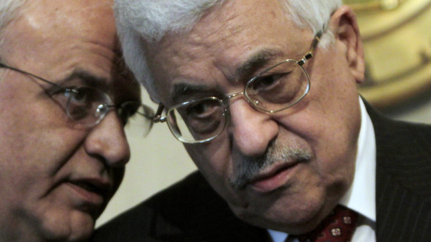 Whisperer: Saeb Erekat, left, talks to Palestinian President Mahmoud Abbas in 2008.