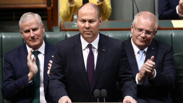 Treasurer Josh Frydenberg handing down last year's federal budget. A promised $7.1 billion surplus has been replaced with a near $84 billion deficit with even more red ink to come.