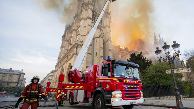 Fire fighters working at the burning Notre-Dame cathedral.