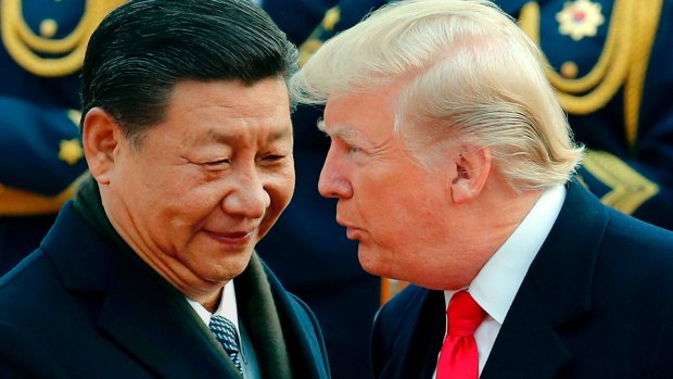 Chinese President Xi Jinping chats to Donald Trump during a welcome ceremony in Beijing in 2017.  