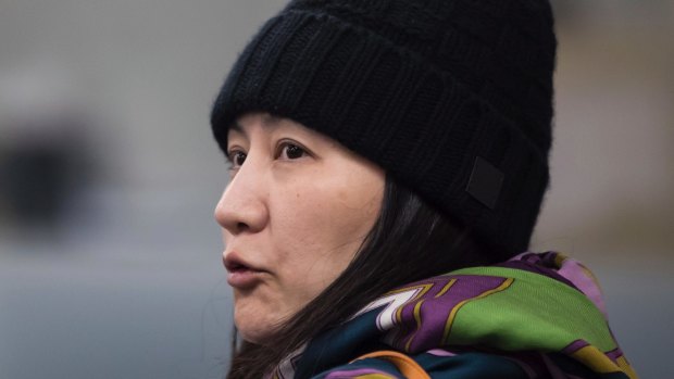Huawei chief financial officer Meng Wanzhou talks with a member of her private security detail in Vancouver.