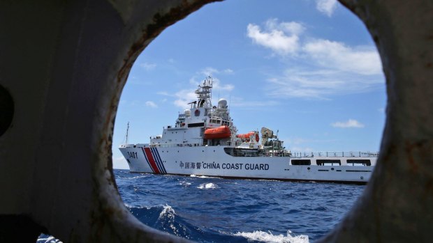 A Chinese coast guard ship attempts to block a Philippine government vessel as the latter tries to enter Second Thomas Shoal in the South China Sea to relieve Philippine troops and resupply provisions.