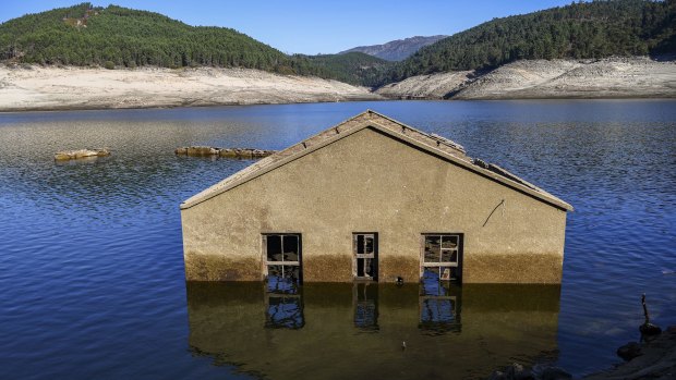 One of the submerged Aceredo village buildings emerging from the river Lima in Lobios, Ourense, Spain, in October.