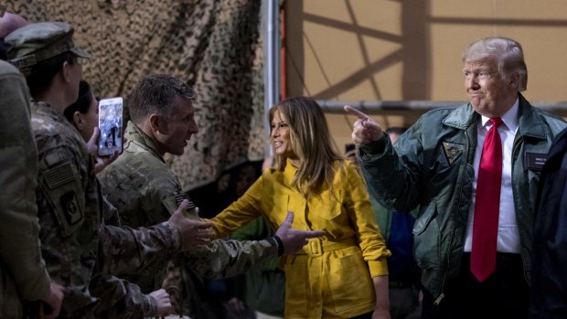 President Donald Trump and first lady Melania Trump greet the military at Al Asad Air Base, Iraq, on December 26, 2018. 