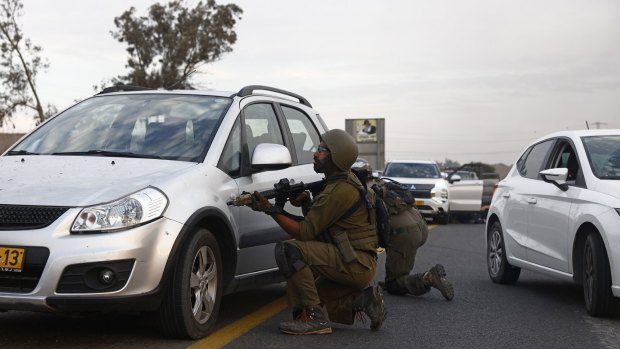 Israeli soldiers in combat against Hamas soldiers on a road near Sderot, Israel, on Saturday.