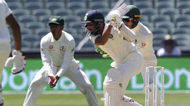 Patience of a monk: Cheteshwar Pujara fights a lone hand for India on day one of the first Test.